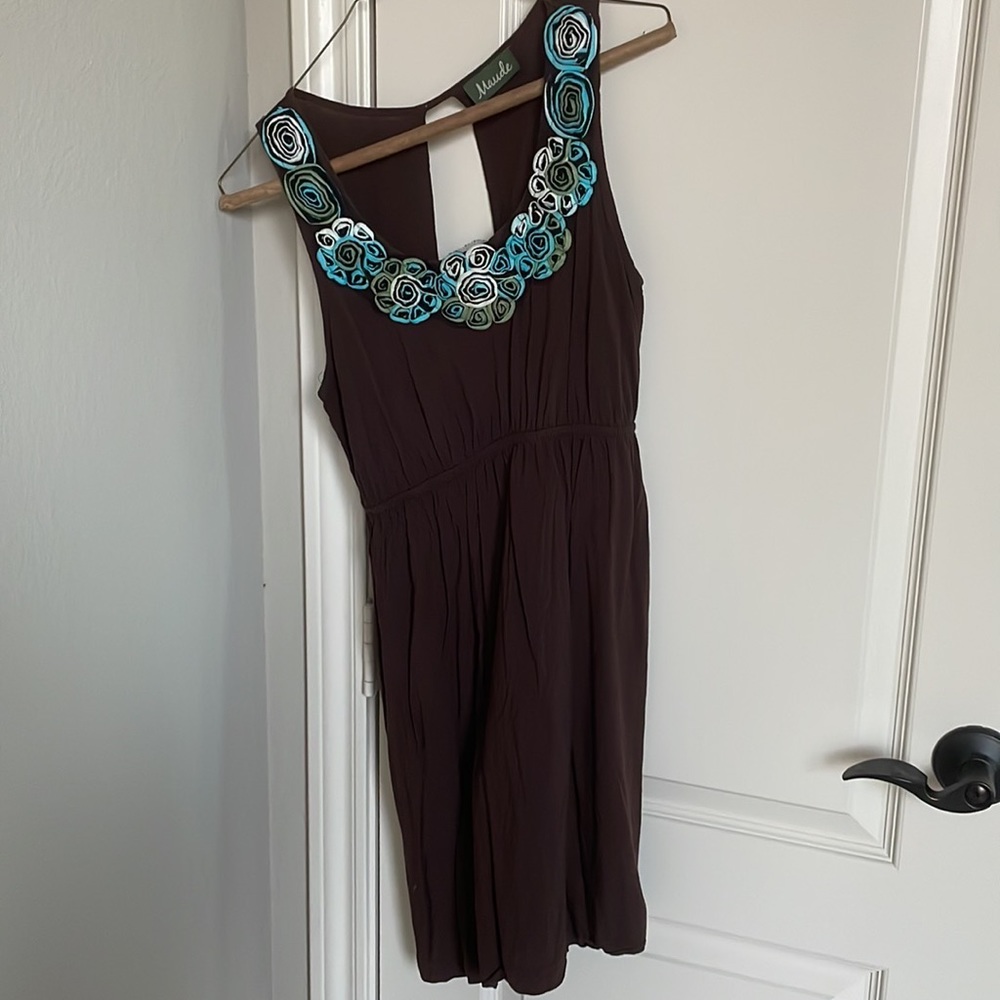 Dress with flower detail and open back